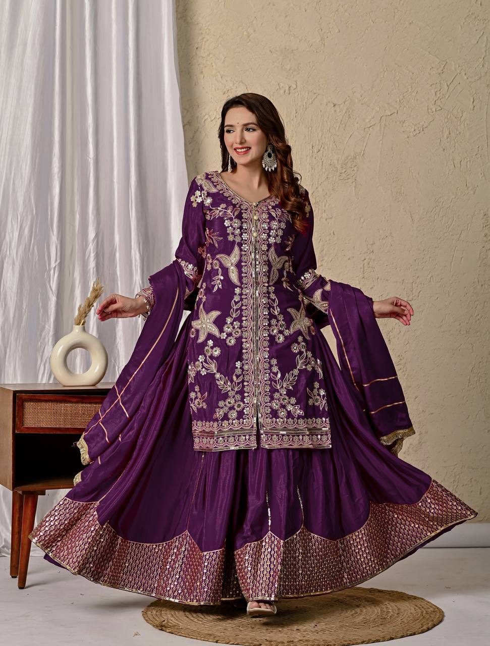 Regal Wine Purple Kurti and Flared Palazzo Suit Set Embellished with Intricate Floral Zari and Mirror Work